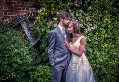 Newbury wedding photography couple by water wheel