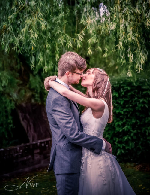 Newbury-based photographer captures wedding couple by willow tree