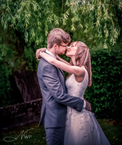 Newbury-based photographer captures wedding couple by willow tree