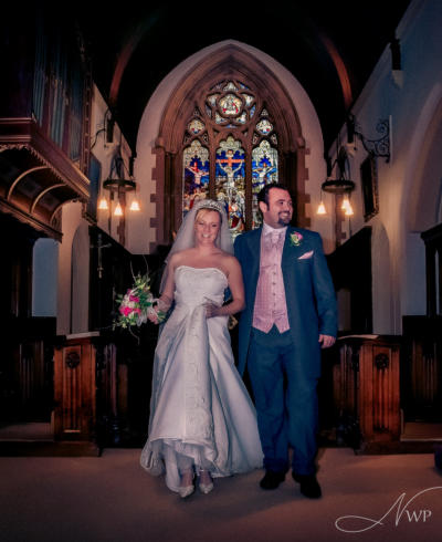 Berkshire photographer creates wedding image of couple by church window, civil ceremony